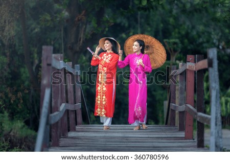 Portrait of Vietnamese girl traditional dress, Ao dai is famous traditional costume for woman in Vietnam