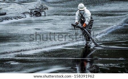 stock-photo-oil-spill-cleanup-at-koh-samet-thailand-158391962.jpg