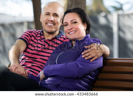 https://thumb9.shutterstock.com/display_pic_with_logo/124564/433483666/stock-photo-mature-happy-couple-sitting-together-on-the-bench-and-holding-each-other-433483666.jpg