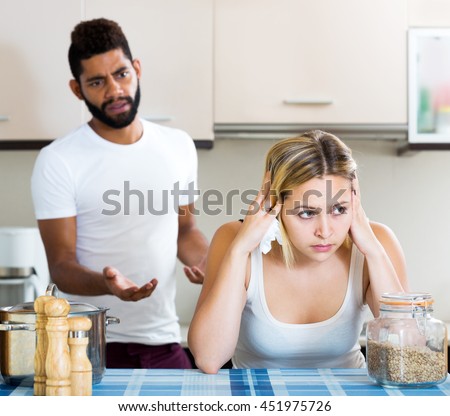https://thumb9.shutterstock.com/display_pic_with_logo/124564/451975726/stock-photo-sad-afro-guy-and-white-girl-fighting-in-domestic-kitchen-focus-on-the-woman-451975726.jpg