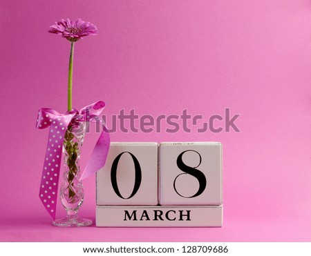 Pink theme, save the date white block calendar for International Women's Day, March 8, decorated with flower, vase and polka dot ribbon.