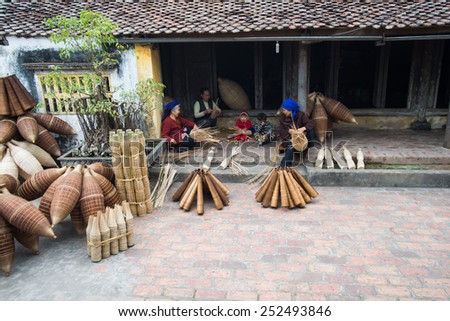 HUNGYEN, VIETNAM - FEB 7 :Unidentified women was weaving bamboo on February 7, 2015 in HungYen, Vietnam. Weaving this tools that used to catch fish is traditional occupation in Hung Yen province.
