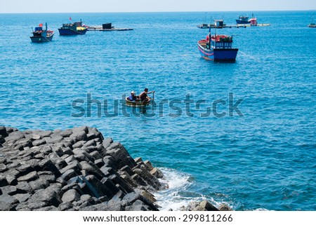 PHU YEN, VIETNAM, June 12, 2015. Fishers on boats in the sea near Ganh Da Dia. Ganh Da Dia is a famous travel place in middle of Vietnam.