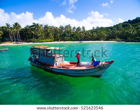 PHU QUOC, VIETNAM - NOVEMBER 19, 2016: Fishermen on boat in Phu Quoc island, Kien Giang, Vietnam.