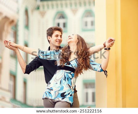 https://thumb9.shutterstock.com/display_pic_with_logo/1286701/251222116/stock-photo-happy-couple-of-young-people-together-in-the-streets-love-story-of-man-and-woman-who-travel-to-251222116.jpg