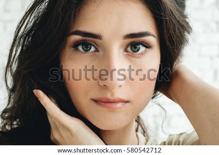 Beautiful Woman Natural Casual Portrait over brick wall.