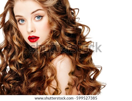 SAYKA stock photo woman with red lipstick curly hair fashion girl with healthy long wavy hair beauty brunette 599527385