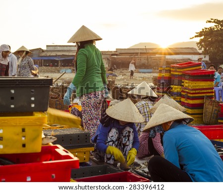 Long Hai, Ba Ria - Vung Tau Province, Vietnam - 31 May 2015: A group of local people doing daily's work at Phuoc Hai Fish Market, Long Hai, Ba Ria - Vung Tau province, Vietnam