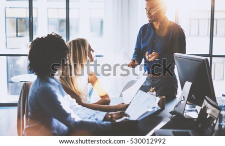 stock-photo-young-team-of-coworkers-making-great-meeting-discussion-in-modern-coworking-office-hispanic-530012992.jpg