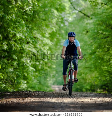 Biker on the forest road