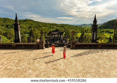Beautiful woman with Vietnam culture traditional ,vintage style,Grand stairs in Imperial Khai Dinh Tomb in Hue, Vietnam