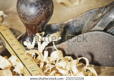 Old carpentry tools on a wooden table - stock photo