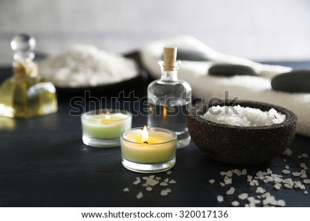 Composition of spa treatment on table colorful background