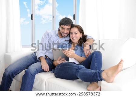 https://thumb9.shutterstock.com/display_pic_with_logo/1390159/258578372/stock-photo-young-happy-attractive-hispanic-couple-lying-together-on-living-room-sofa-couch-at-home-enjoying-258578372.jpg