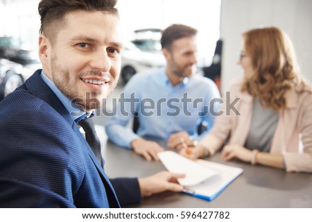 Close up of salesman dealing with clients