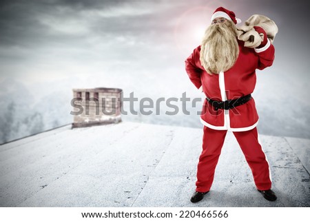 winter landscape from roof and big man in red