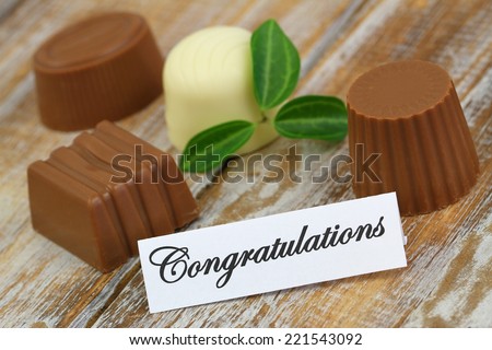 https://thumb9.shutterstock.com/display_pic_with_logo/1444193/221543092/stock-photo-congratulations-card-with-assorted-chocolates-221543092.jpg