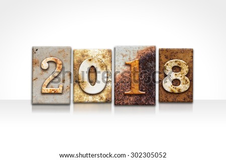 The word "2018" written in rusty metal letterpress type isolated on a white background.