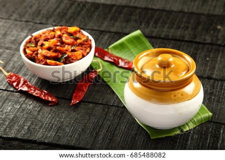 Spicy garlic pickle  in white bowl.