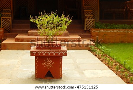 HYDERABAD,INDIA-AUGUST 28: tulasi kota a small podium like arrangement with holy plant in front of Hindu house on August 28,2016 in Hyderabad,India                                             