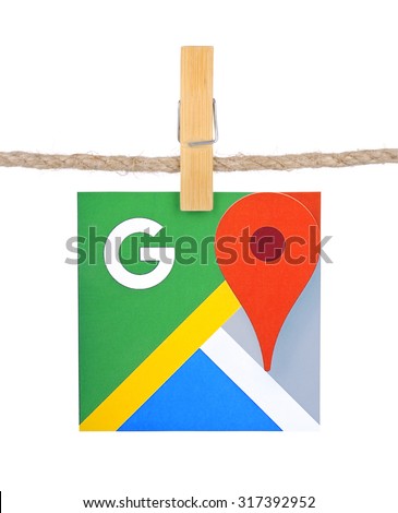 KIEV, UKRAINE - SEPTEMBER 16, 2015:Logo Google Maps hanging on the clothesline isolated on white background.Google Maps set of applications map service and technology provided by the company Google