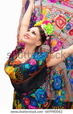 https://thumb9.shutterstock.com/display_pic_with_logo/1475165/669980062/stock-photo-beautiful-smiling-mexican-woman-in-traditional-mexican-dress-hands-up-holding-the-skirt-as-a-669980062.jpg