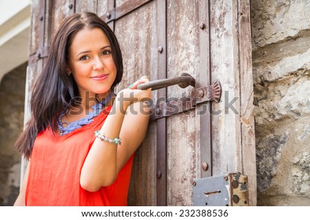 https://thumb9.shutterstock.com/display_pic_with_logo/1477187/232388536/stock-photo-young-girl-on-the-street-brunette-travels-the-most-beautiful-european-ancient-city-beautiful-232388536.jpg