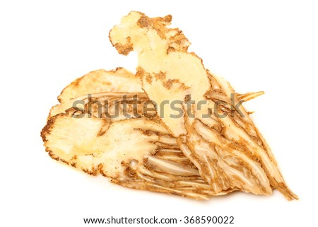 Angelica root used in chinese traditional herbal medicine, over white background. Radix angelicae sinensis, Dang gui.