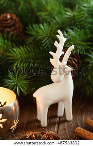 white deer christmas decoration on rustic background with candle lantern and fir branch - White Deer Christmas Decoration white deer christmas decoration on rustic background with candle lantern and fir branch - White Deer Christmas Decoration