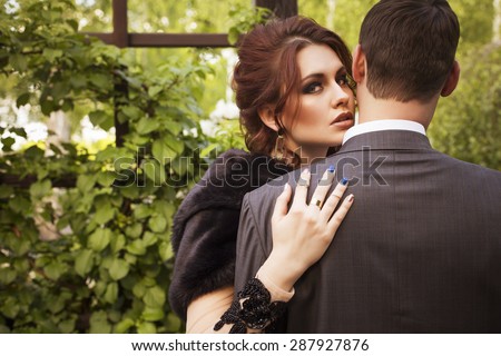 https://thumb9.shutterstock.com/display_pic_with_logo/1582970/287927876/stock-photo-beautiful-sexy-brunette-luxury-rich-woman-standing-on-a-balcony-near-garden-in-evening-long-black-287927876.jpg