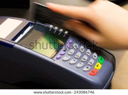 Hand Swiping Credit Card In Store