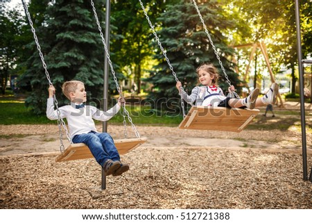 Smiling Little Girl Boy On Swing Stock Photo 512721388 - Shutterstock