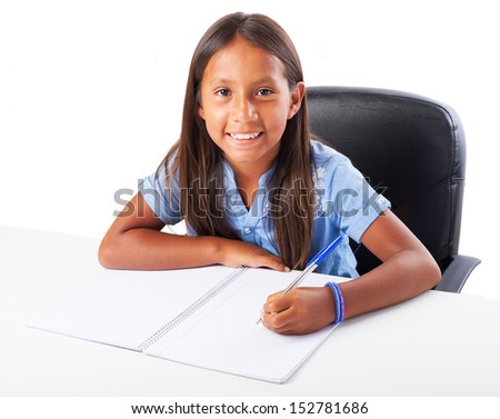 girl smiling doing homework on a white background