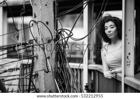 Black and white urban portrait of young asian woman Black and white urban portrait of young asian woman