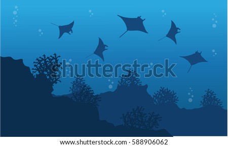 Silhouette of stingray and reef underwater landscape