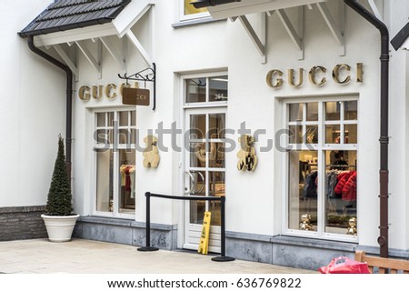 Roermond, Netherlands 07.05.2017 Logo and shop of GUCCI Store Mc Arthur Glen Designer Outlet shopping area