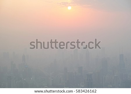 Shanghai, China - March 2, 2016: aerial view of the sunset in fog city.