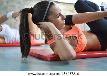 beautiful young women working out in the fitness studio