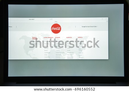Milan, Italy - August 10, 2017: Coca cola website homepage. It is is a carbonated soft drink produced by The Coca-Cola Company. Cola logo visible.