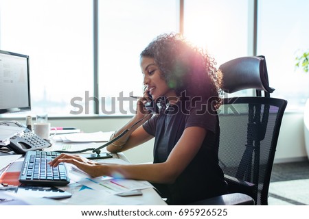 Woman Entrepreneur Busy With Her Work In Office Young Talking Over Telephone While Working Woman Entrepreneur Busy With Her Work In Office Young Talking Over Telephone While Working