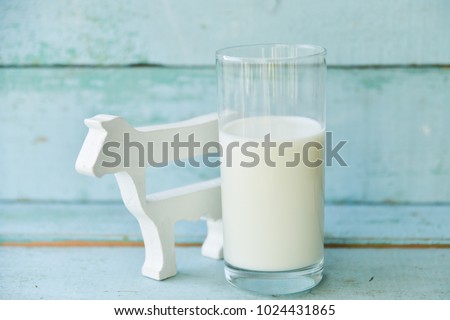 a glass of cow's milk and cow, the concept of gluten and village products