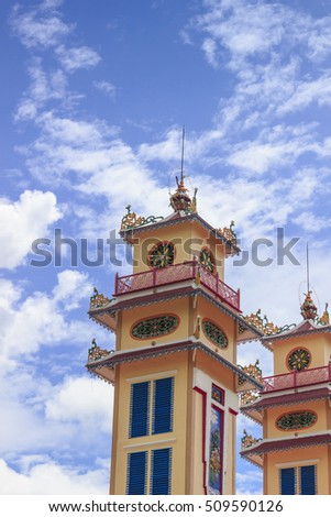 TAY NINH, VIETNAM - October 23, 2016:Cao Dai temple area and meditating followers of the Cao Dai religion in the temple Cao Dai
