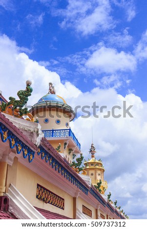 TAY NINH, VIETNAM - October 23, 2016:Cao Dai temple area and meditating followers of the Cao Dai religion in the temple Cao Dai
