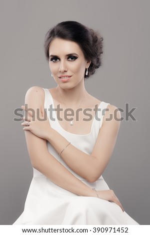 https://thumb9.shutterstock.com/display_pic_with_logo/1649021/390971452/stock-photo-beautiful-elegant-woman-in-white-dress-wearing-jewelry-portrait-of-a-gorgeous-bride-with-diamond-390971452.jpg
