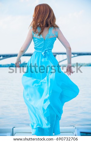 https://thumb9.shutterstock.com/display_pic_with_logo/165196586/690732706/stock-photo-gorgeous-woman-in-long-beautiful-flying-dress-elegant-girl-in-fluttering-dress-fashion-style-690732706.jpg