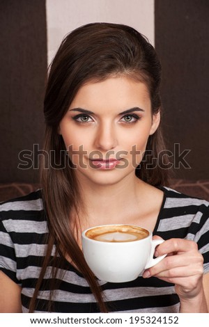 http://thumb9.shutterstock.com/display_pic_with_logo/1672675/195324152/stock-photo-close-up-of-beautiful-brunette-drinking-coffee-attractive-girl-holding-cup-and-smiling-195324152.jpg