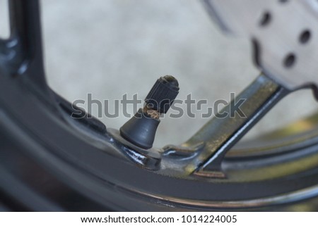 stock-photo-motorcycle-tire-valve-stem-1014224005.jpg