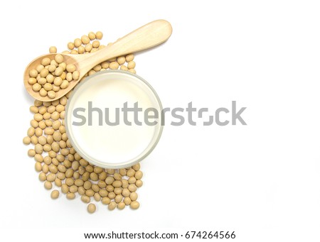 Above view of soy milk with soybean on the spoon isolated on white background. Have a copy space ready for your text.