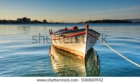 Lonely boat in the pier of Eretria port in Greek island Evia