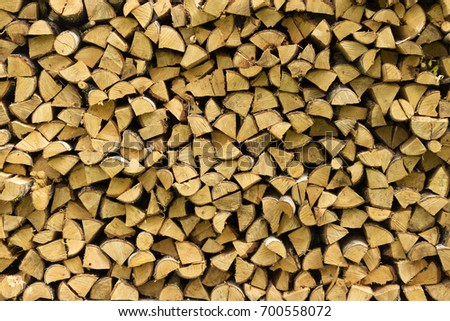 stock-photo-wooden-logs-beams-firewood-frame-a-lot-of-wood-wooden-log-wooden-background-fuel-harvesting-700558072.jpg